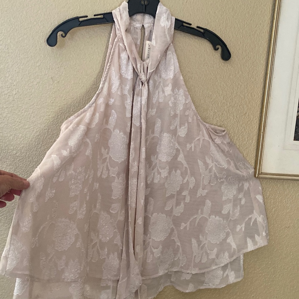 Champagne and white sleeveless blouse.  Great with jeans or shorts.